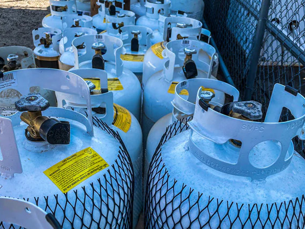 Multiple propane tanks stored together, ready for installation and setup