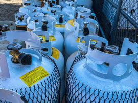 Multiple propane tanks stored together, ready for installation and setup